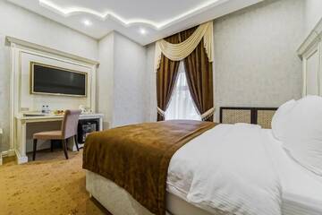 Фото номера Двухместный номер Делюкс с 1 кроватью Отель Astoria Boutique Hotel г. Минск 3