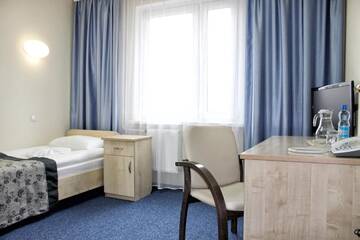 Фото номера Стандартный трехместный номер Отель East Time Hotel г. Минск 3