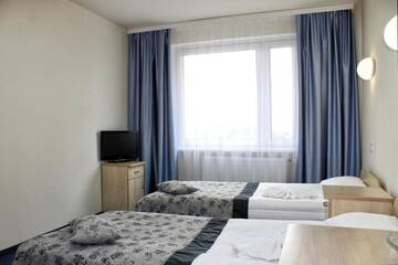 Фото номера Стандартный трехместный номер Отель East Time Hotel г. Минск 4
