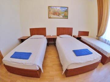 Фото номера Стандартный двухместный номер с 2 отдельными кроватями и общей ванной комнатой Гостевой дом Grand Inn г. Минск 13